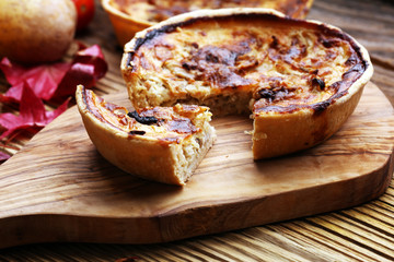 Homemade Cheesy Egg Quiche for Brunch with Spinach and Tomato, onions and zucchini.