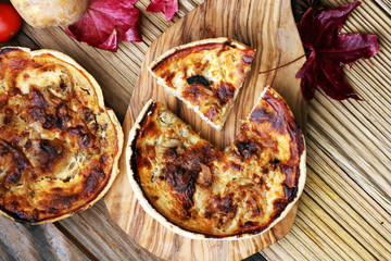 Homemade Cheesy Egg Quiche for Brunch with Spinach and Tomato, onions and zucchini.