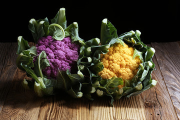 Colorful cauliflower cabbages on table. Healthy food.