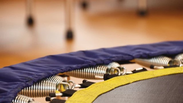 Fitness trampoline rebounder close up tilt.