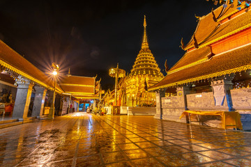 Naklejka premium Wat Phra That Doi Suthep and reflection on wall. The most famous landmark temple in Chiang Mai, Thailand