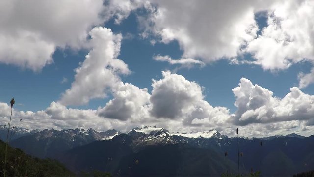 Dramatic Clouds Moving Over Mt. Olympus On A Sunny Day In Washington State. Time Lapse.