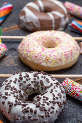 Children party background with sweet colorful donuts and candy