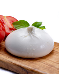 Fresh soft white burrata, ball buttery cheese, made from a mix of mozzarella and ricotta cream, original from Apulia region, Italy, very popular soft cheese in USA