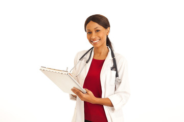 Professional African female doctor smiling and holding clipboard on white