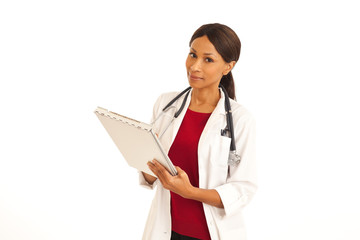 Professional African female doctor smiling and holding clipboard on white