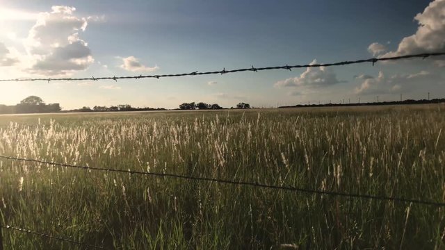 Stormy weather and sunny weather over the same field in the middle of Texas