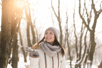 Woman enjoying snowy winter day in nature