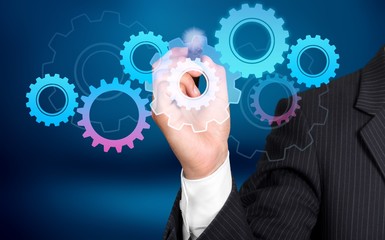 Businessman and analytics symbols on grey background