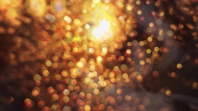Inspirational twisting golden bokeh with smoke and light