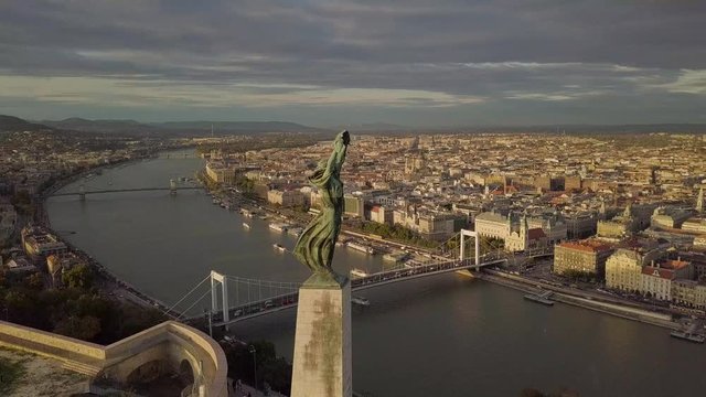 Aerial drone footage of the statue of liberty on gell&radic;&copy;rt hill budapest at sunset