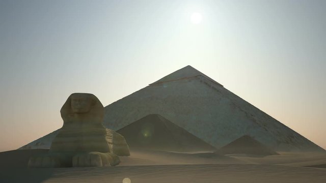 Sunrise above pyramids and sphinx