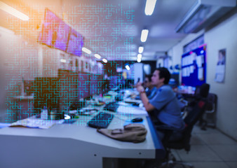 Blurred of man engineer works with the tablet in the production control room.Control room of a steam Turbine,Generators of the coal-fired power plant for monitor process, business and industry concept
