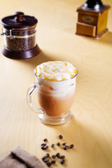 ice caramel macchiato on a wooden table