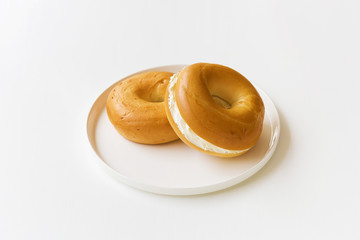 cream cheese bagels on a white tray