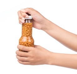 hand holding bottle of salted Soybeans isolate on white background