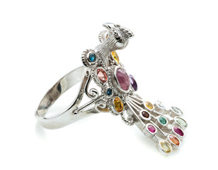 Peacock Ring with differet color gemstone on whit background