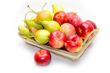 pears and apples in basket on white background 