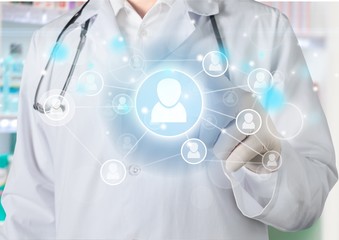 Medical icons and young  doctor with stethoscope