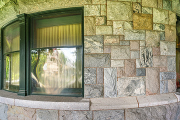 Curved Stone Wall With Window Reflection