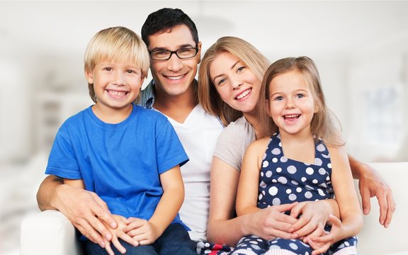 Beautiful Smiling Lovely Family Indoors