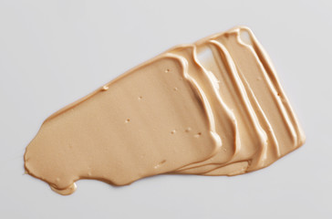 the texture of a foundation liquid, a white background