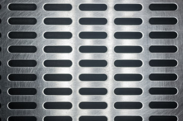 stainless steel grating with oblong holes, close up