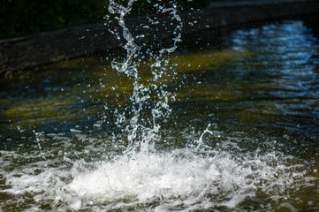 transparent falling water vertical flows, close up