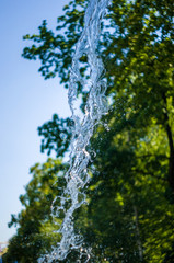 transparent falling water vertical flows, close up