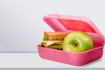 Lunchbox with an apple isolated on background
