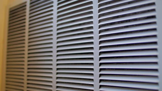 Slow move in on slighly dusty air conditioning vent