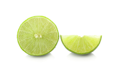 whole and half with slice of fresh green lime isolated on white background