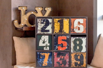 unusual wooden furniture. trendy interior item for creative home design.wooden inscription Joy. old funny decorative dresser with numbers.interesting antique wooden painted chest.art school
