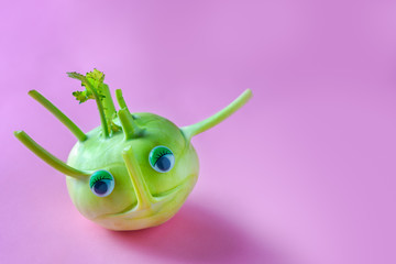 Kohlrabi character over a pink background.