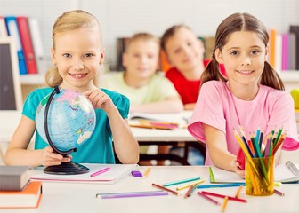 Fototapeta premium School Children in the Classroom Writing /