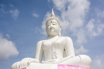 White Buddha and sky background Phra Buddha Rattanamanee Mahaborphit Chonlasit Mongkholchai, Located near Pa Sak Jolasid Dam Thailand.
