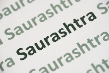 word Saurashtra  language printed on paper macro