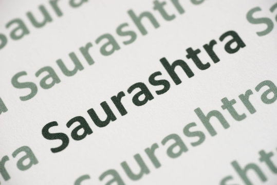 word Saurashtra  language printed on paper macro
