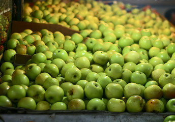 green apples on the market at night