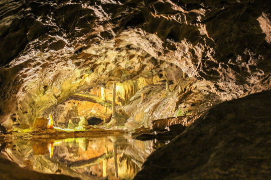 The beautiful cave complex with stalactite and stalagmite and the reflection in the St Beatu Cave, Switzerland