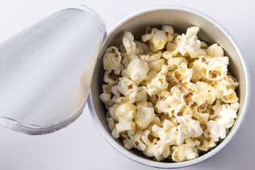 Popcorn in cardboard box isolated on white background