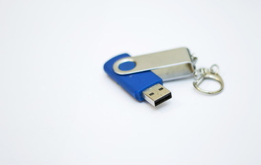 Blue usb flash drive for storing information on a white background close-up