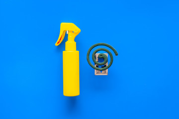 Obraz premium Mosquito protectors. Individual and for open space. Green spiral and spray on blue background top view space for text