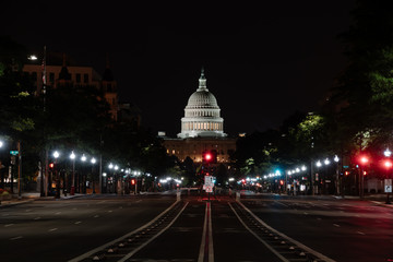 The U.S. Capitol at night as seen from an empty Pennsylvania Avenue