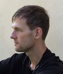 Obraz premium Portrait of handsome young man from side