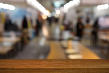 Wooden table in front of blurred background
