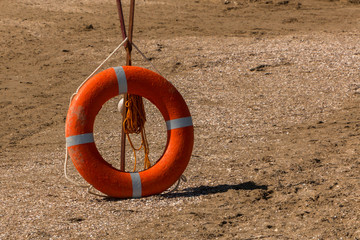 sand, beach, lifebuoy on the beach. Inventory of rescuers on the beach