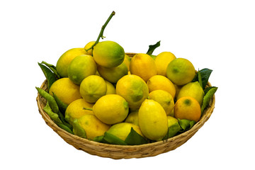 Lemons in basket isolated on white background