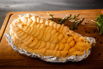 delicious baked dorado under egg whites with herbs