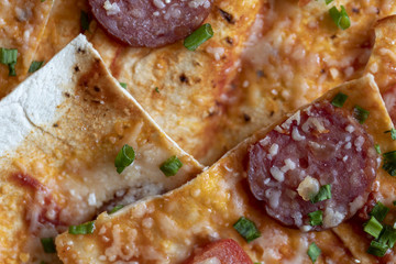 A close up of a pepperoni pizza